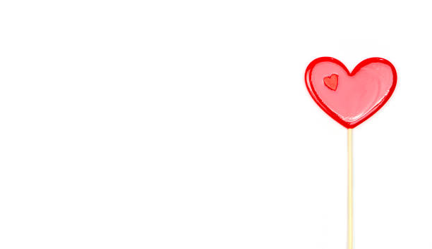 istock Lollipop hearts on white background. Congratulations, space for text. 1390229841