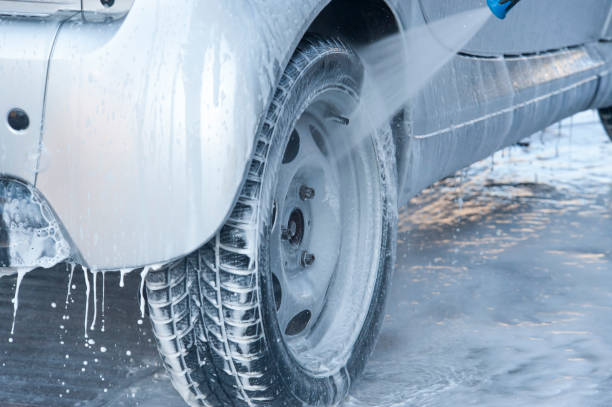 istock Washing a car with pressure. 1390230563