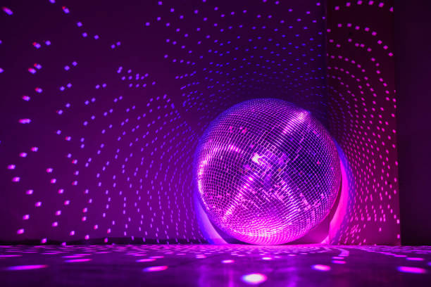 disco ball reflecting violet light in a dark hall for discos. - dancing floor imagens e fotografias de stock