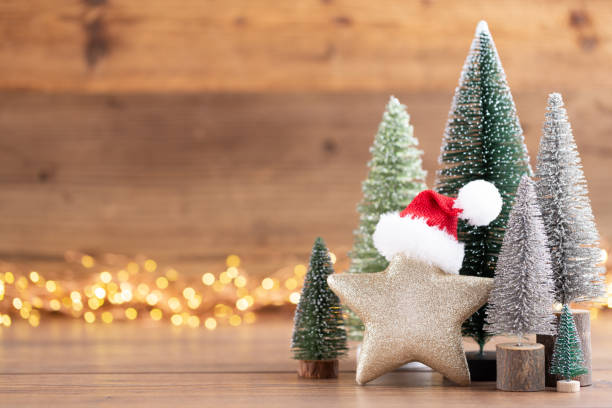 istock Colorful Christmas tree on wooden, bokeh background. 1390233023