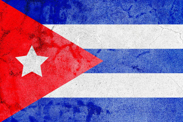 istock Rustic painted cuban flag on cracked old concrete wall 1390233669