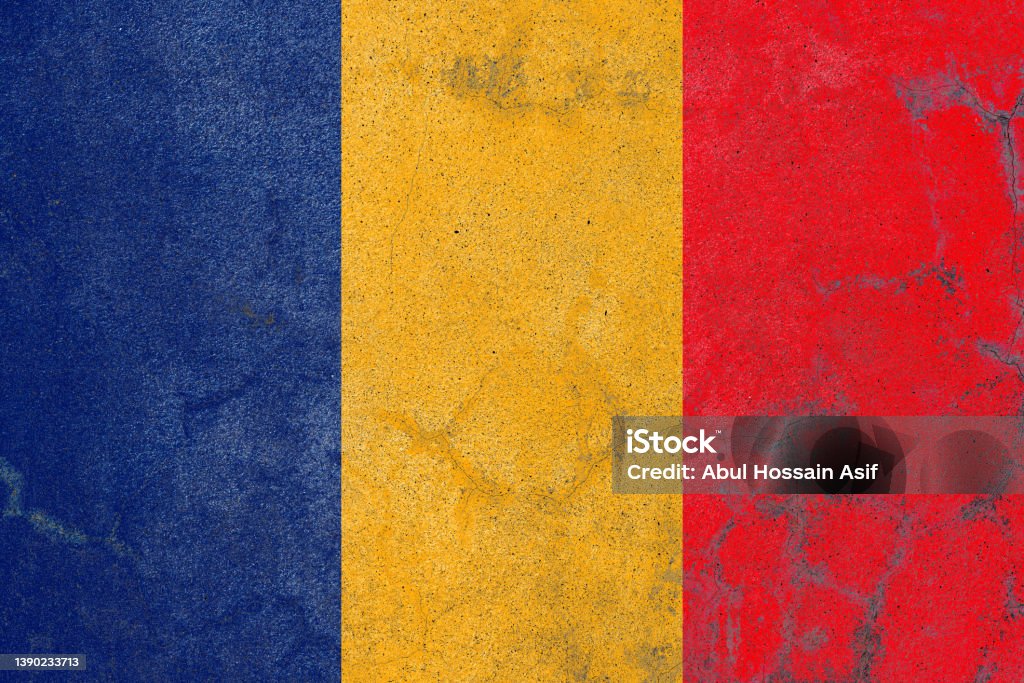 Rustic painted romania flag on an old abandoned concrete wall Aging Process Stock Photo