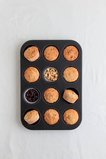 istock Fresh baked muffins in a baking pan 1390233849