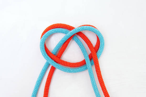 istock Heart symbol made of two colored cords on gray 1390239524