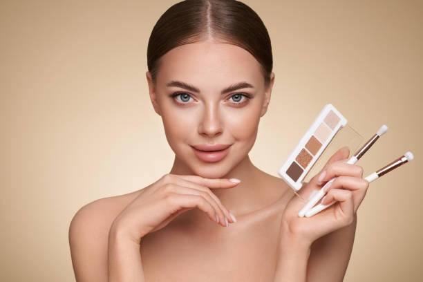 istock Beauty woman with eye shadow makeup palette 1390242050