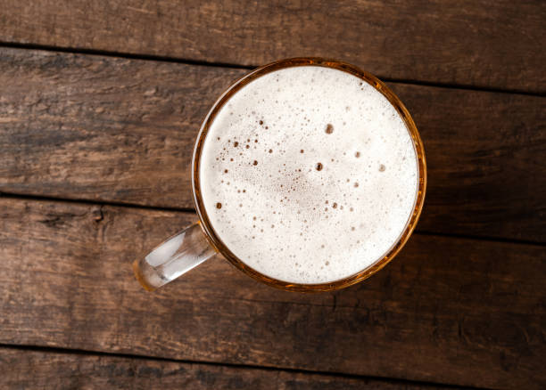 istock Beer glass on an old wooden table. Top view 1390242470