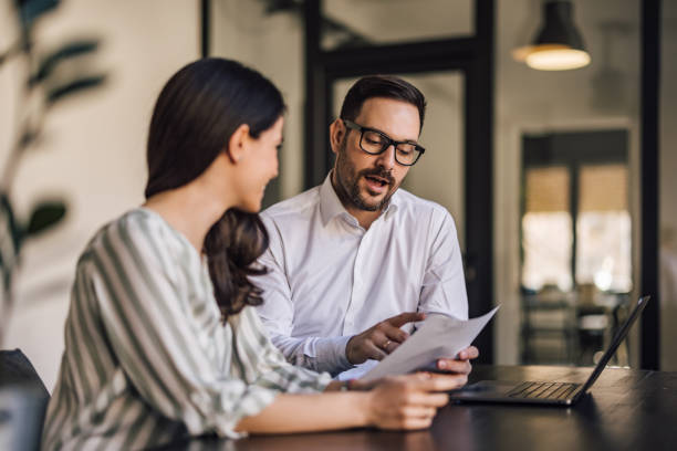 istock Business couple working together at the office. 1390242656