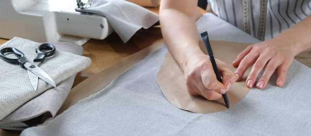 istock Sewing. Recycling Made by hand from home.sewing machine and the project quarantine, lockdown.Hobby,meditation,zero waste,recycling.Girl sews clothes  home on sewing machine, ecology,sewing backround 1390243416