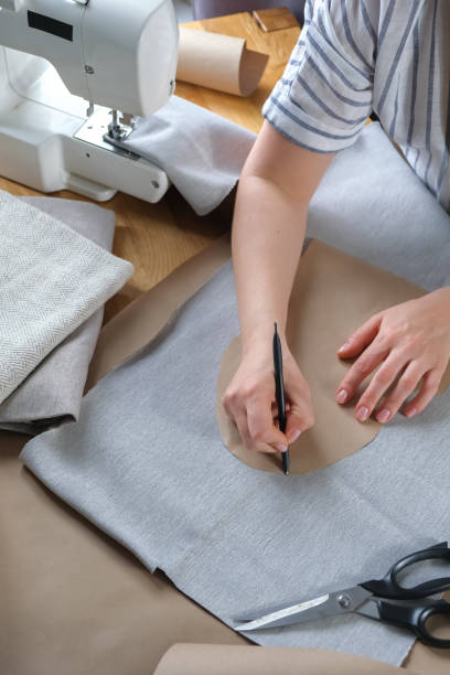 istock Sewing. Recycling Made by hand from home.sewing machine and the project quarantine, lockdown.Hobby,meditation,zero waste,recycling.Girl sews clothes  home on sewing machine, ecology,sewing backround 1390243433