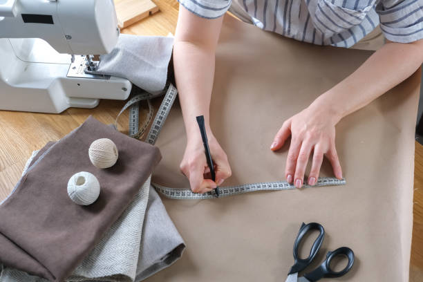 istock Sewing. Recycling Made by hand from home.sewing machine and the project quarantine, lockdown.Hobby,meditation,zero waste,recycling.Girl sews clothes  home on sewing machine, ecology,sewing backround 1390243440
