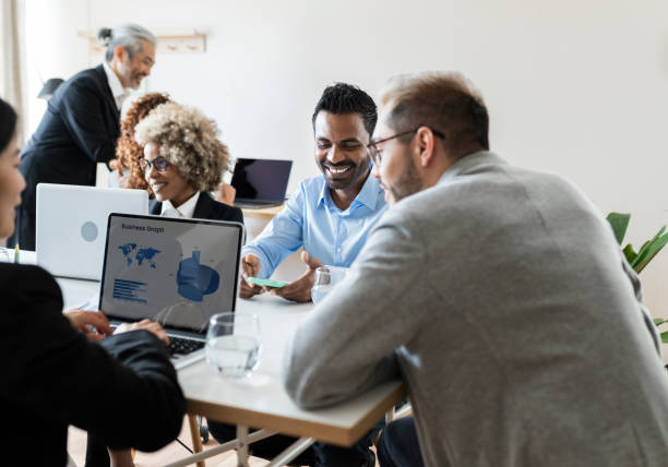 istock group of multiracial business entrepreneurs working in an office setting 1390244885