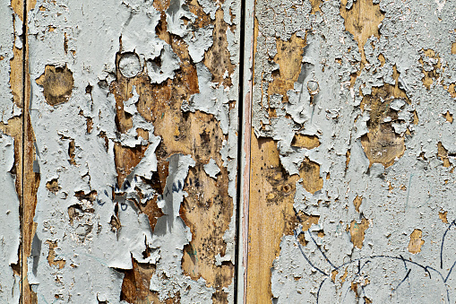 Paint pealing off a wooden door background