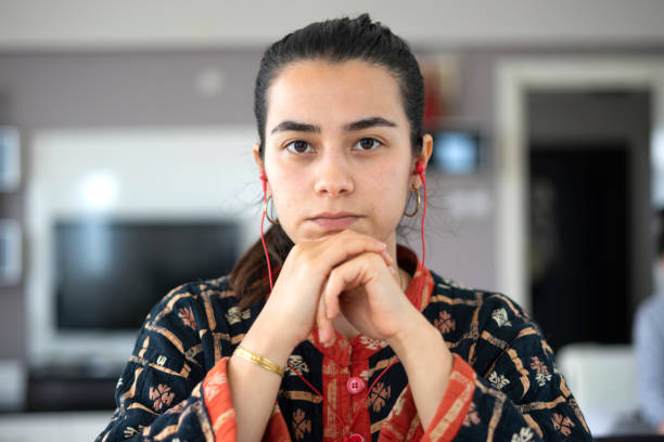 portrait of young woman making video call, meeting, looking at the camera stock photo