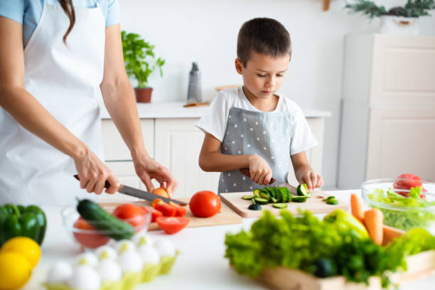 istock Son is helping mother at home. 1390254300