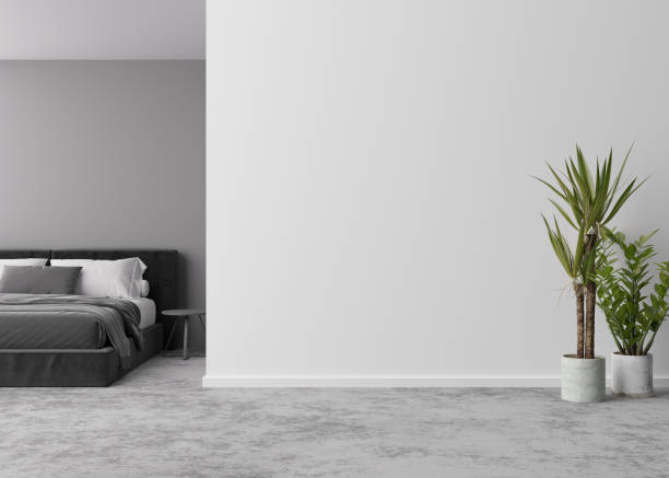 istock Empty room, concrete floor and light gray wall. Bed, plant. Mock up interior. Free, copy space for your furniture, picture, decoration and other objects. 3D rendering. 1390256032