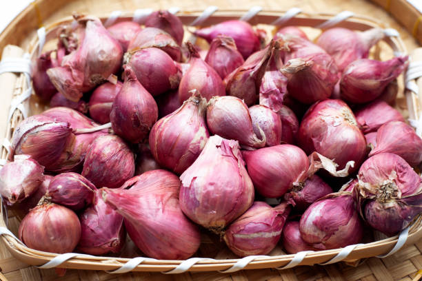 istock Shallots onion in bamboo basket plate 1390256821
