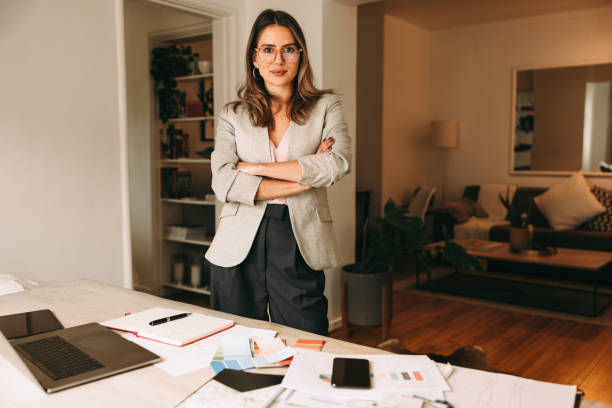istock Confident interior designer standing in her home office 1390257314