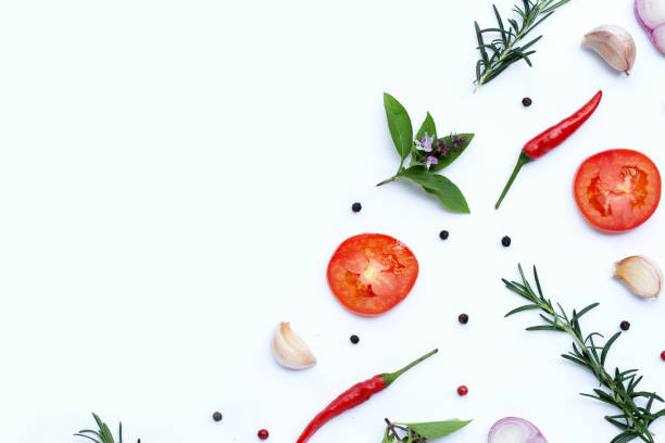 istock Cooking ingredients, Various fresh vegetables and herbs on white background. 1390258937