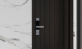 Digital door handle on dark oak wood door.