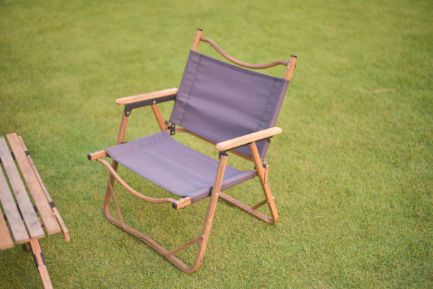 istock Camping chair on green grass. 1390262326