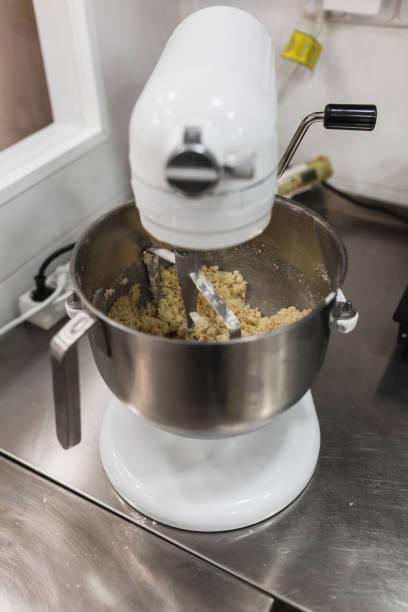 istock Electric mixer beating mixture in a pastry 1390263786