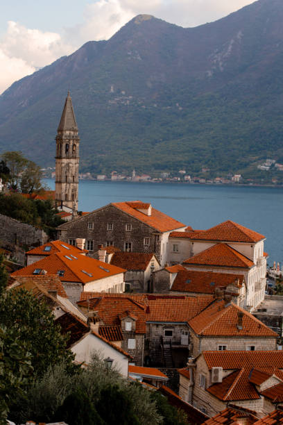 Fishing boats on waves on mediterranean european coast Ancient medieval town on Mediterranean European coast. dubrovnik walls stock pictures, royalty-free photos & images