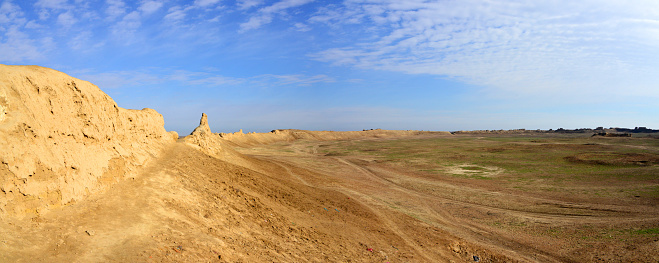 With a farm and silos in the distance,  a large Middle Mississippian mound stands in the Azatlan State Park.  The Native American mound dating from 900 A.D was abandoned around 1200 A.D.