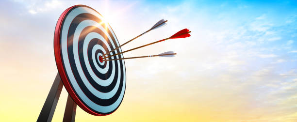 istock Archery target and arrow on sunrise sky 1390268656
