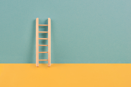 Ladder of success, opportunity strategy, blue and yellow background, copy space for text, step by step concept, progress in business and education, have a goal
