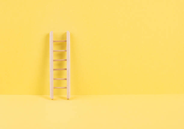 istock Ladder of success, opportunity strategy, yellow background, copy space for text, step by step concept, progress in business and education, have a goal 1390269884