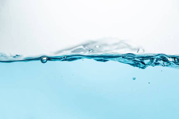 istock spilled water drop on the floor isolated on white background. 1390271218