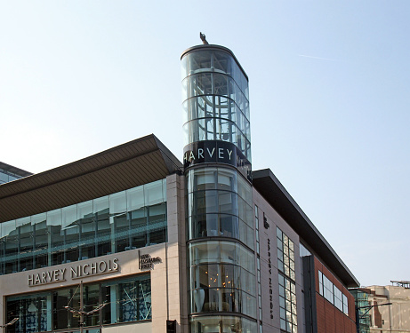 manchester, united kingdom - 24 march 2022: sign above the harvey nichols department store in manchester city centre