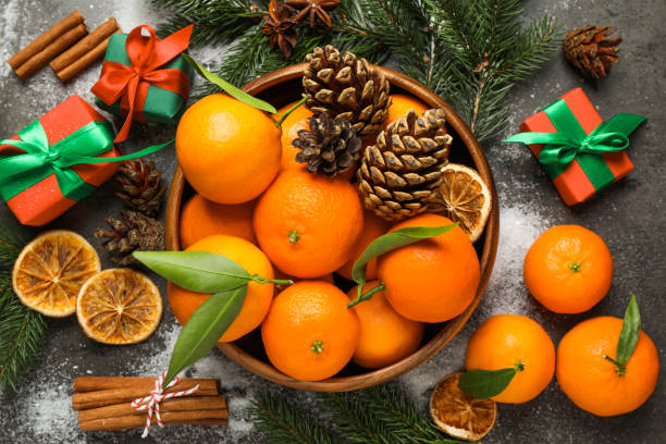 istock Christmas composition with fresh tangerines and gifts on grey background, flat lay 1390275324
