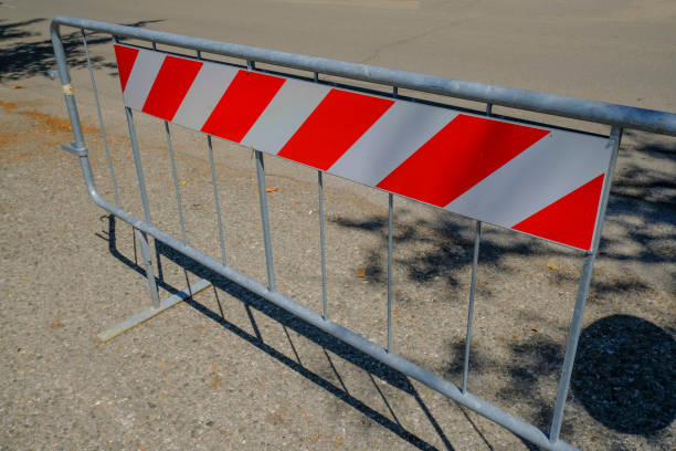 Road closed sign. Construction in process. Fenced pit on the road