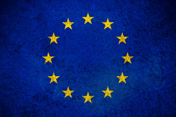 istock Europe Union flag, grunge texture background. Flag painted on concrete wall 1390277573