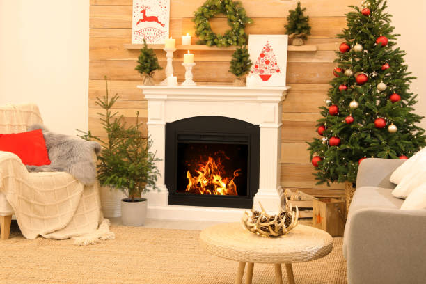 istock Beautiful living room interior with burning fireplace. Christmas celebration 1390278393