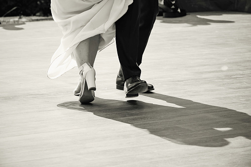 A mature couple in a ballroom dancing pose.