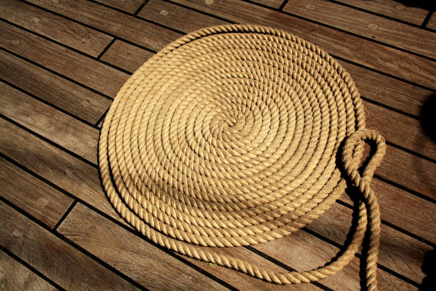 istock Boat rope circles on wooden deck. Background, texture. 1390285744