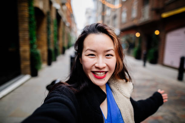 istock Young asian woman taking selfie 1390288064