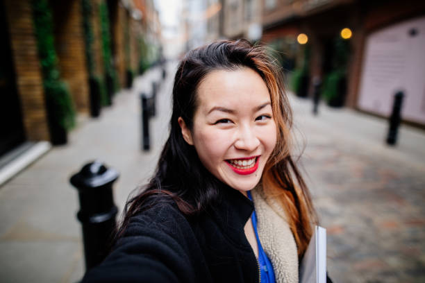 istock Young asian woman taking selfie 1390288196