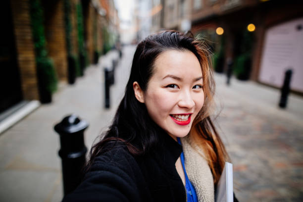 istock Young asian woman taking selfie 1390288364
