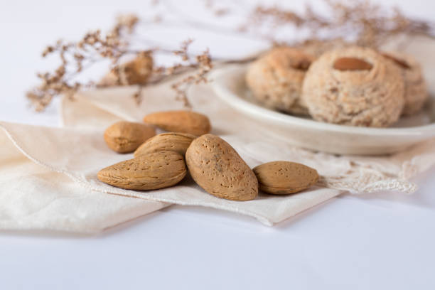 istock Almendrados, dumplings or typical biscuits made from almonds, sugar and egg yolk. Almond cakes on white background. 1390288681