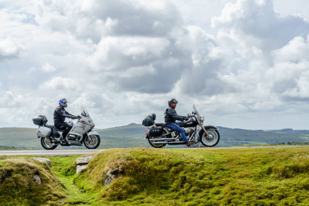 two motorbikes are on a road