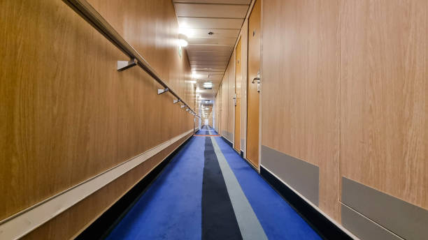 istock Empty Corridor to Ferry Number Door. Internal Corridor Hallway on Ferry Ship. Luxury Cruise Ship Cabin Corridor 1390293089