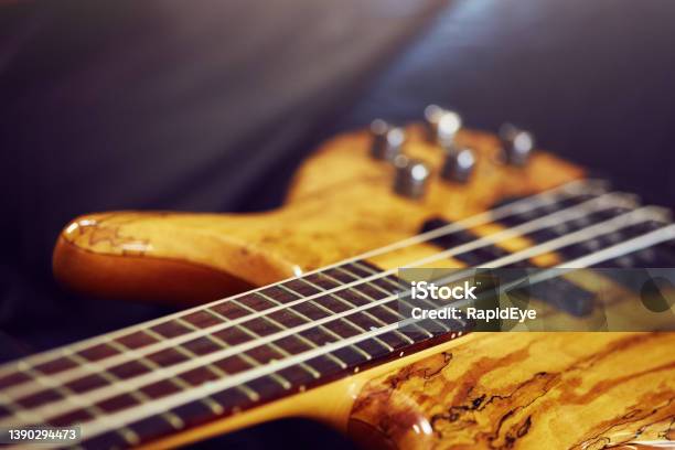 Detail Of A Beautiful Bass Guitar With An Intricate Wooden Top Made Of Spalted Maple Stock Photo - Download Image Now