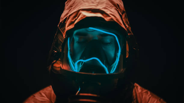 istock Man with suit and gas mask at night 1390296612