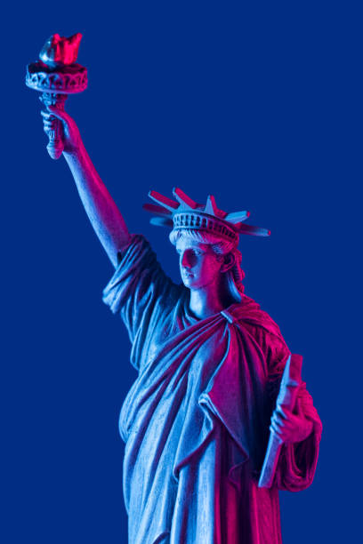 istock Statue of liberty close up with neon illumination background. 1390297364