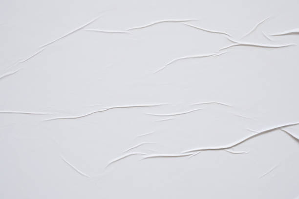 istock white crumpled and creased paper poster texture background 1390298817