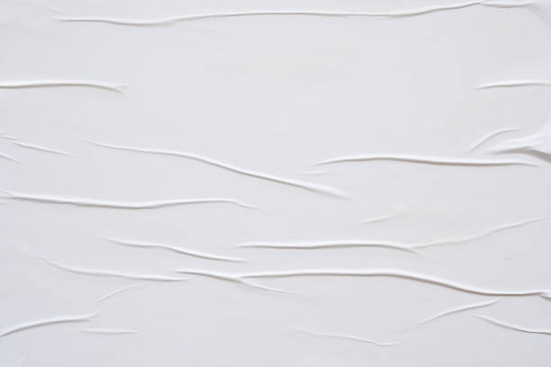 istock white crumpled and creased paper poster texture background 1390298819