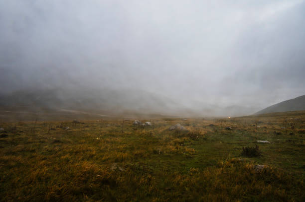 Landscape inside Campo Imperatore during a cloudy autumnal day with very low clouds, Gran Sasso National Park, Abruzzo, Italy